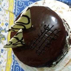 A picture of Eggless chocolate cake with truffle sauce.