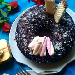 A picture of Marble cake with chocolate sauce.