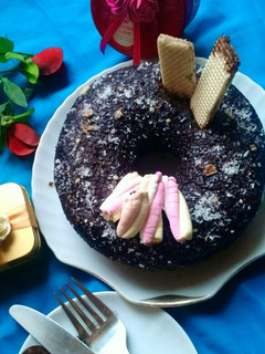 A picture of Marble cake with chocolate sauce.