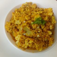 A picture of Saucey eggs with cheese.