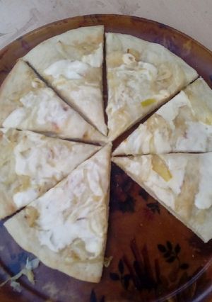 Una foto de Pizza de cebolla