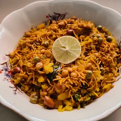 A picture of Vegetable Poha with Mangalorean Mixture.