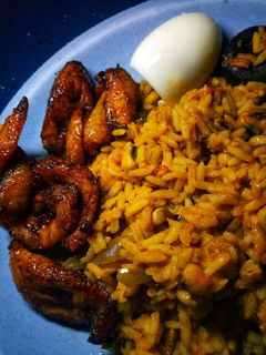 A picture of Jollof rice n beans.