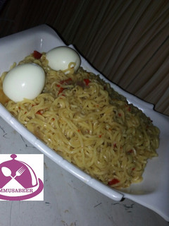 A picture of Noddles jollof with egg.