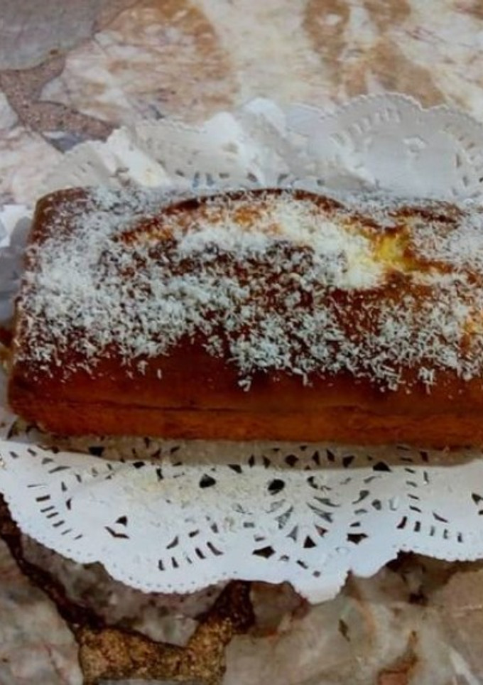 Una foto de Budín de coco relleno con dulce de leche
