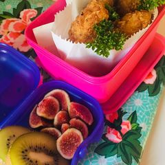 A picture of Crumbed chicken strips with fresh delicate figs and kiwi.