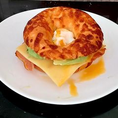 A picture of My filled cheese topped Bagel 🥯 🥓 🧀 🥑 🥚.