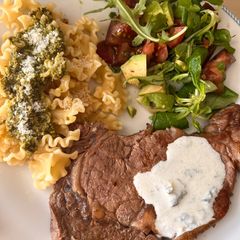 A picture of Steak with Pasta and Salad.