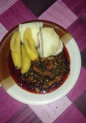 A picture of Boil yam and plantain with vegetable sauce.