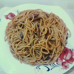 A picture of Spaghetti jollof & torn titus smoked fished.