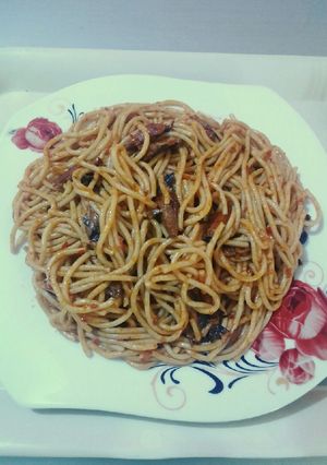 A picture of Spaghetti jollof & torn titus smoked fished.