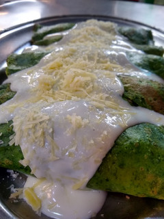 Una foto de Canelones de espinaca relleno de pollo