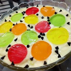 A picture of Mango custard with colored vermicelli.