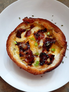 A picture of Bagel Egg Boat with Candied Bacon.