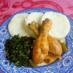 A picture of Ugali, chicken and kales.
