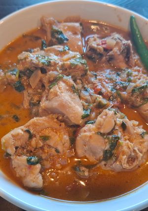 A picture of Dahi Chicken Curry with Fenugreek Leaves.