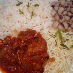 A picture of Rice,beans,spaghetti and stew.