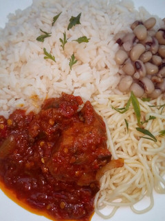 A picture of Rice,beans,spaghetti and stew.