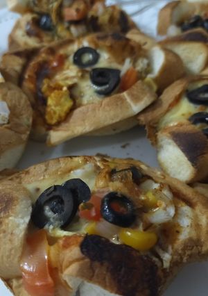 A picture of Bread pizza cups ready in 10 minutes.