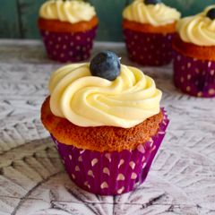 A picture of Blueberry Cupcakes with Lemon Frosting.