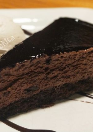 A picture of Chocolate Fudge Brownie with Vanilla Ice cream and chocolate sauce.