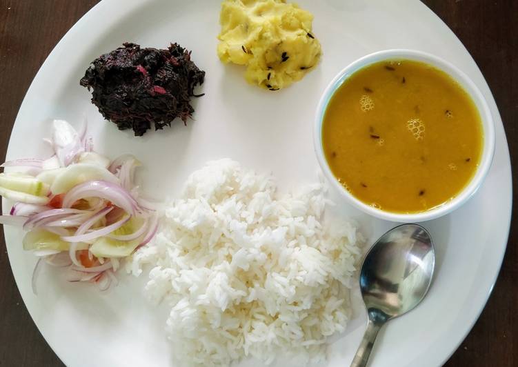 Plain veg thali with plain rice, plain tur tadka dal, aloo choka, Lal sag and salad