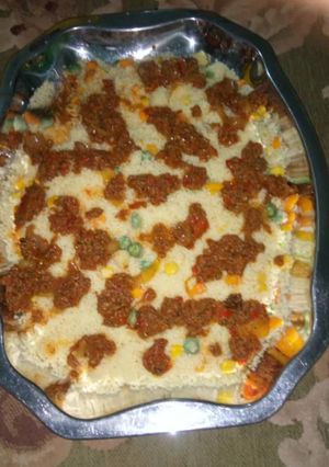 A picture of Kus kus with souce.