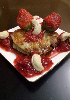 A picture of Bread malpua with strawberry sauce.