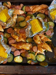 A picture of Sheet pan barbecue chicken and sausage.
