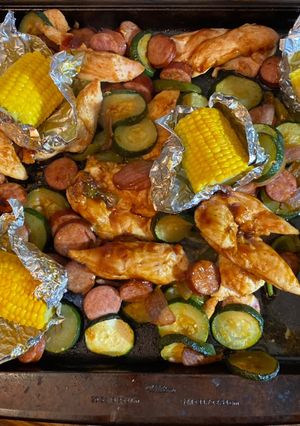 A picture of Sheet pan barbecue chicken and sausage.