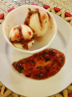 A picture of #localfoodcontest_Kisumu Boiled Eggs with kachumbari.