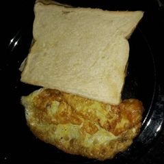 A picture of Fried eggs and sliced bread.