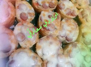 صورة لوصفة خبز بالنقانق والقشقوان 😋😋