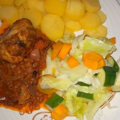 A picture of Boiled potatoes with veggies.