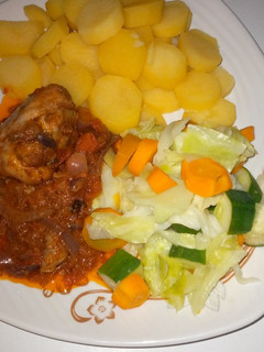 A picture of Boiled potatoes with veggies.