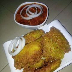 A picture of Boiled potatoes in egg and Sauce.