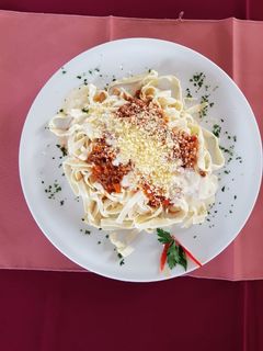 Una foto de Fideos Caseros con Salsa Roja