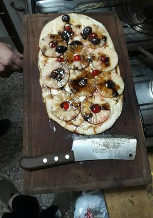 Una foto de Pizza de ananá