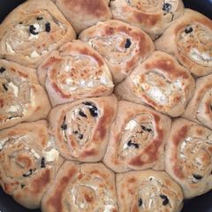 A picture of Cheese and olives pastries.