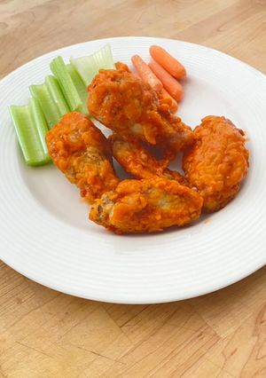 A picture of Saucy and crispy chicken wings.