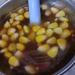 A picture of Hot and sour soup with corns.