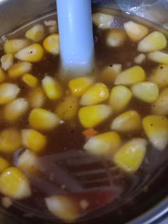 A picture of Hot and sour soup with corns.
