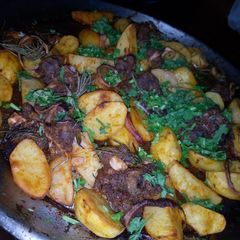 A picture of Oven roasted beef and herb potatoes.