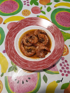 Una foto de Langostinos al vermouth