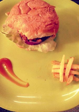 A picture of Veg burger and fries.