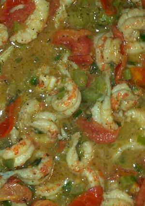 A picture of Creole Crawfish Etouffe with grape tomatoes.