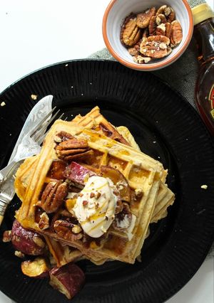 A picture of Sweet Potato and Pecan nut Waffles with Maple syrup.