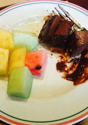 A picture of Chocolate cake with fruits.
