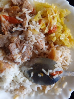 A picture of Rice beef and fried cabbage.