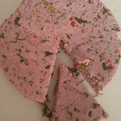 A picture of All natural pink cheese with 7 herbs & spices.